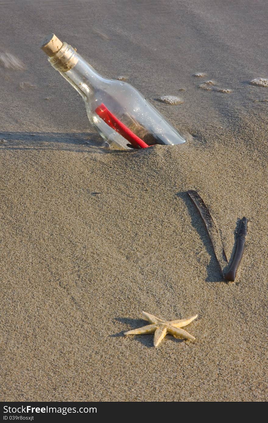 A message in the bottle on sand