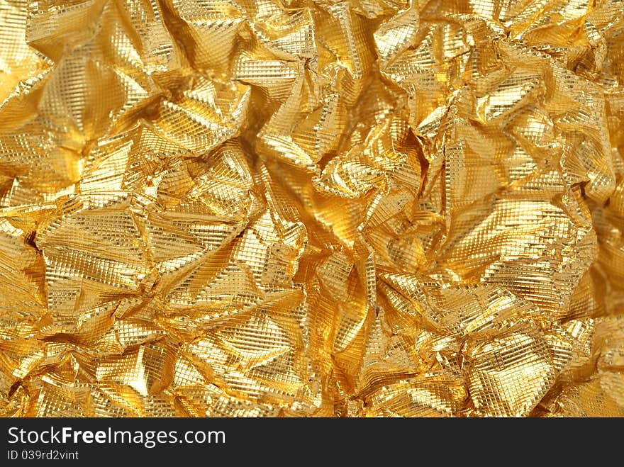 Artistic background from golden foil