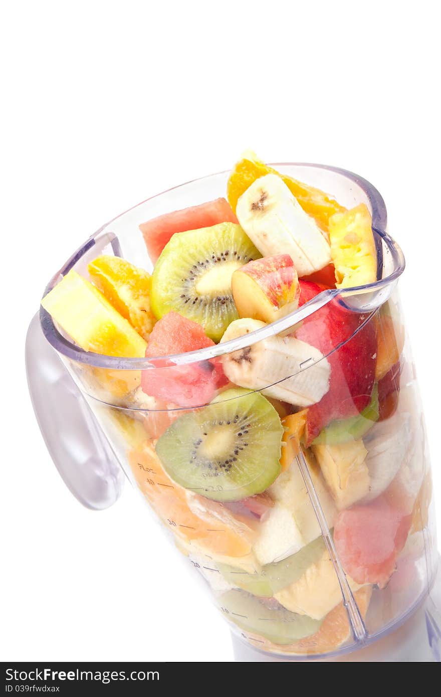 Mixed fruit in mixer with white background. Mixed fruit in mixer with white background