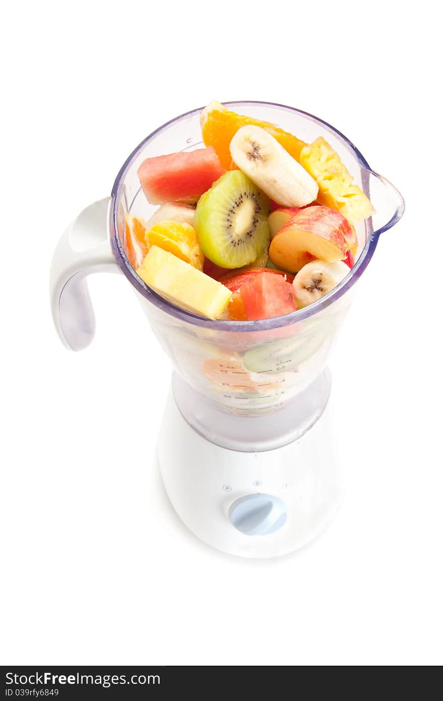 Mixed fruit in mixer with white background. Mixed fruit in mixer with white background