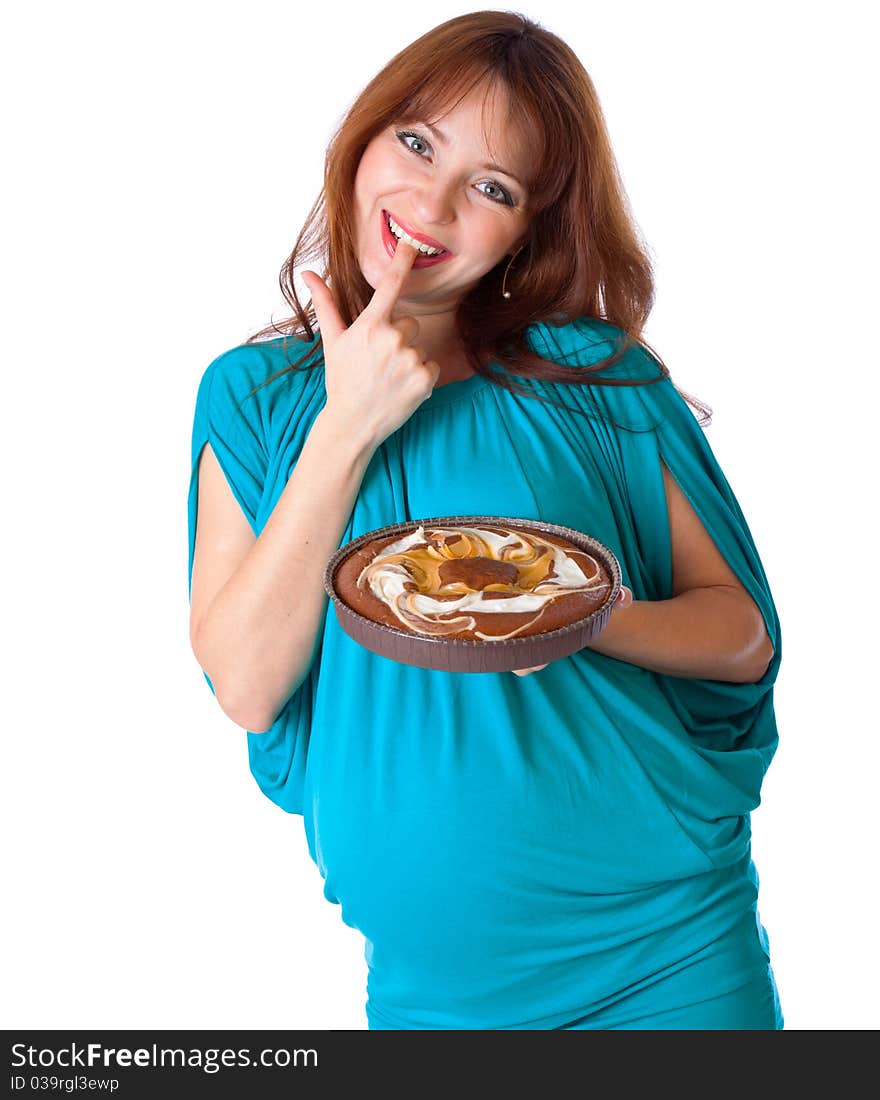 A Smiling Woman Is Tasting The Cake