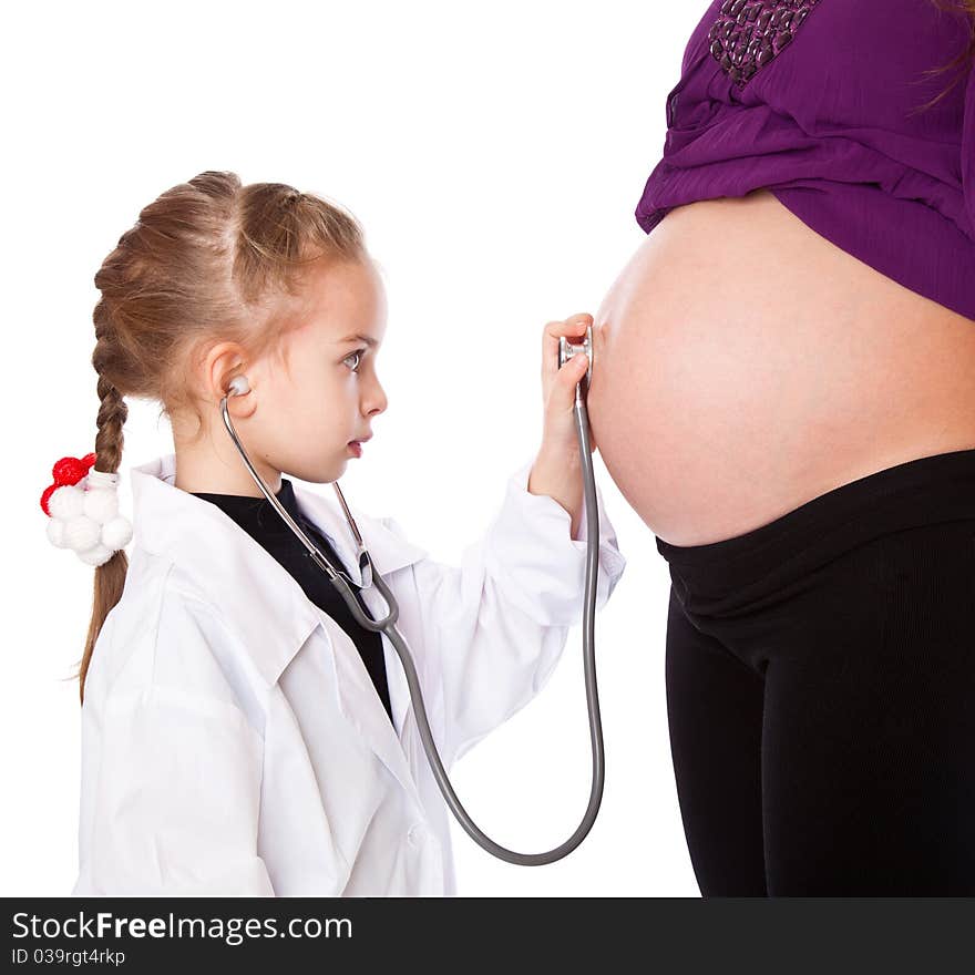 A cute girl is listening to her mother's belly. isolated on a white background