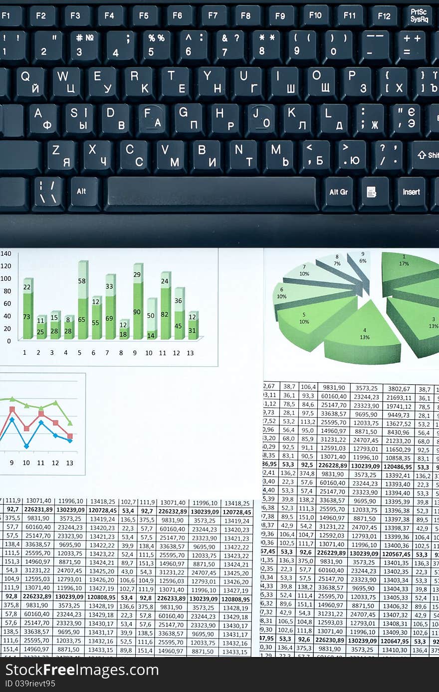 Black keyboard on a stock chart and numbers. Black keyboard on a stock chart and numbers