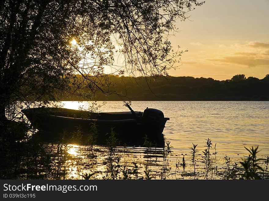 Beautiful Summer sunset over still lake