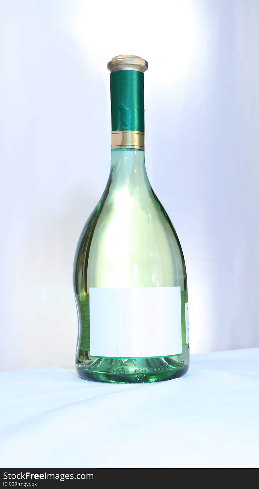 Wine with an empty label on a light background