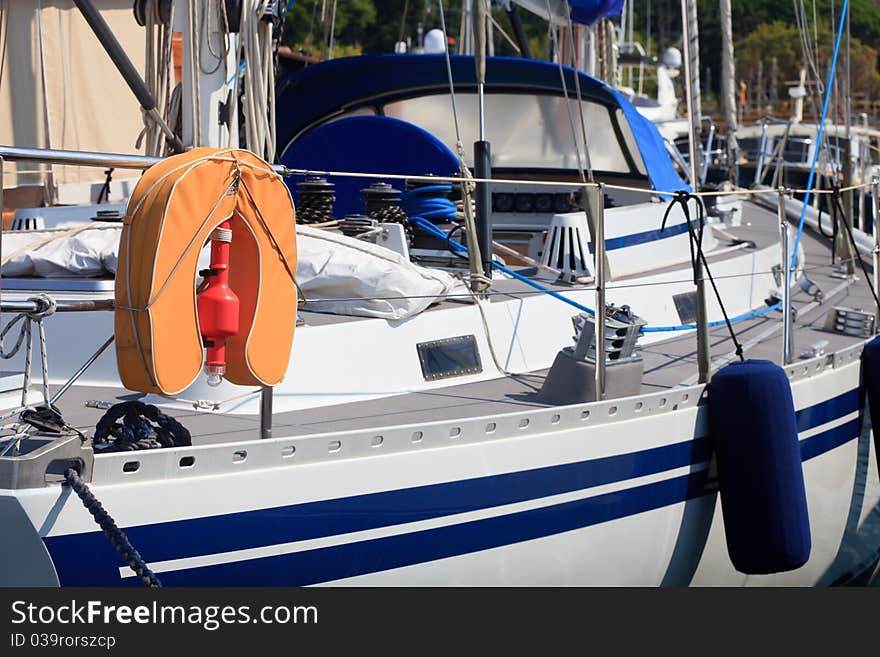 Lifevest and teak deck of a luxury sailboat. Lifevest and teak deck of a luxury sailboat