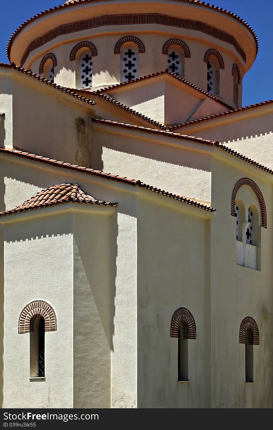 Traditional architecture of greek orthodox church at sunny summer day.