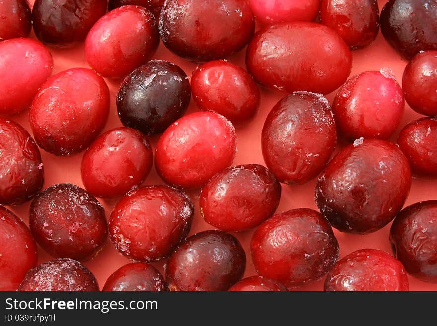 Background of a large frozen ripe cranberries. Background of a large frozen ripe cranberries