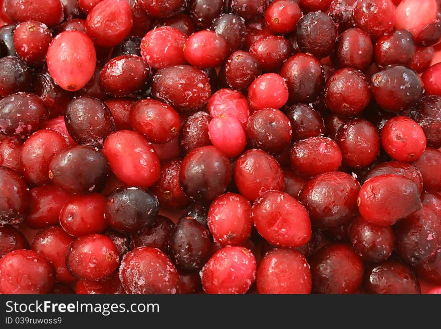 Background of a large frozen ripe cranberries. Background of a large frozen ripe cranberries