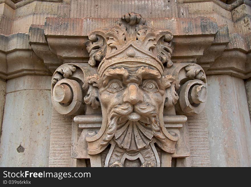 Close-up of one of the numerous sculptured mythological figures on the Wallpavillion of the Zwinger Palace, Dresden. Close-up of one of the numerous sculptured mythological figures on the Wallpavillion of the Zwinger Palace, Dresden