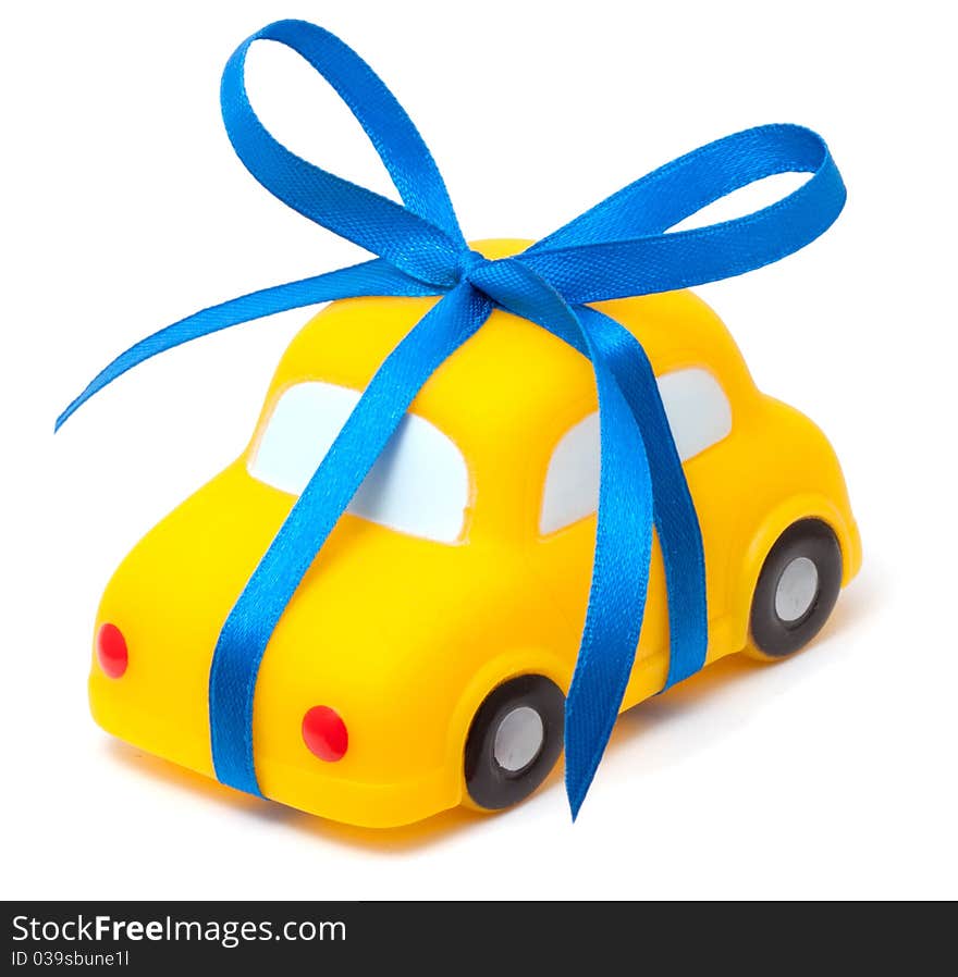 Toy car tied a blue ribbon a simbol of purchase