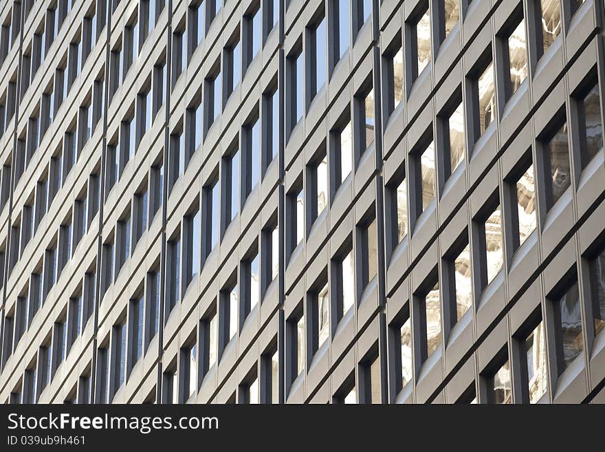 Detail of a modern steel and glass office building. Detail of a modern steel and glass office building