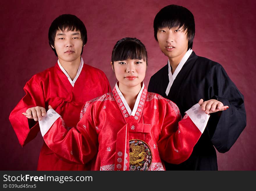 Asian traditional couple on the red background.