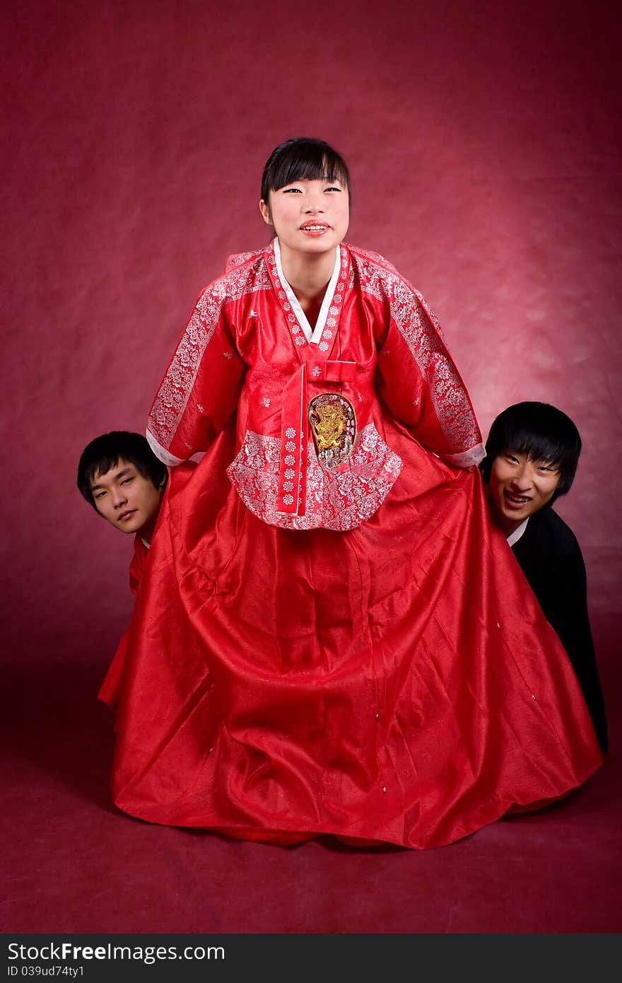 Asian traditional couple on the red background.