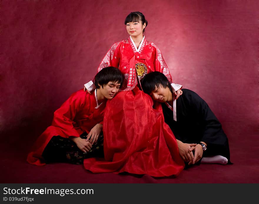 Asian traditional couple on the red background.