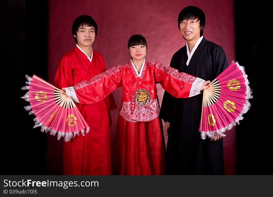 Asian traditional couple on the red background.