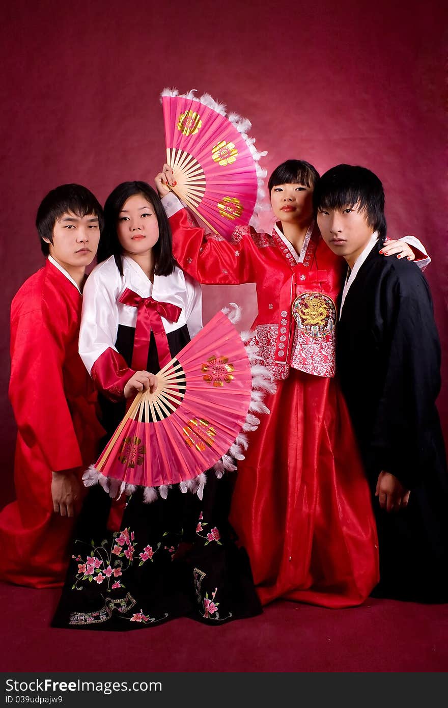 Asian traditional couple on the red background.