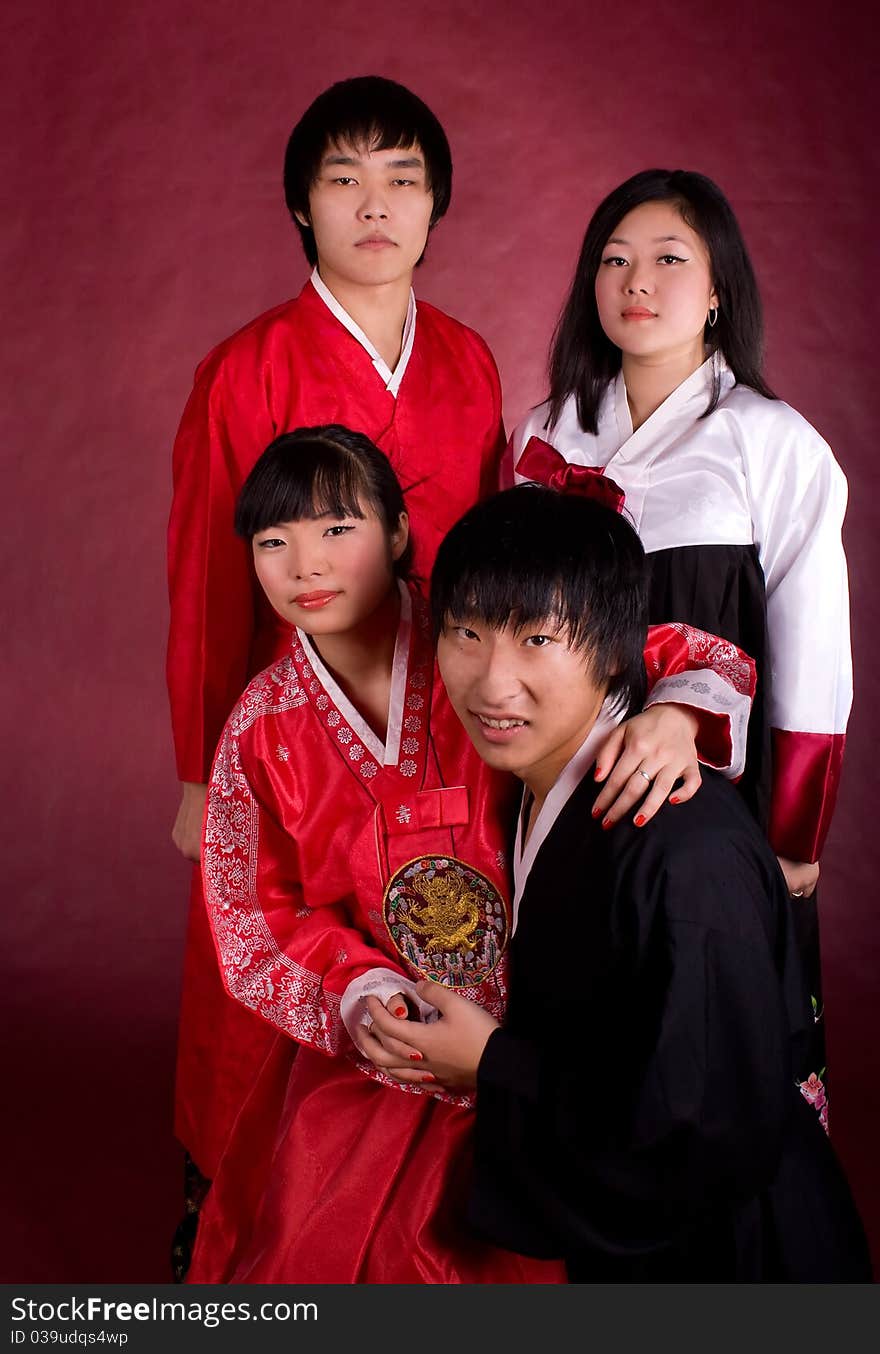 Asian traditional couple on the red background.