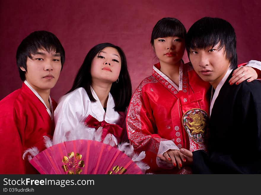 Asian traditional couple on the red background.