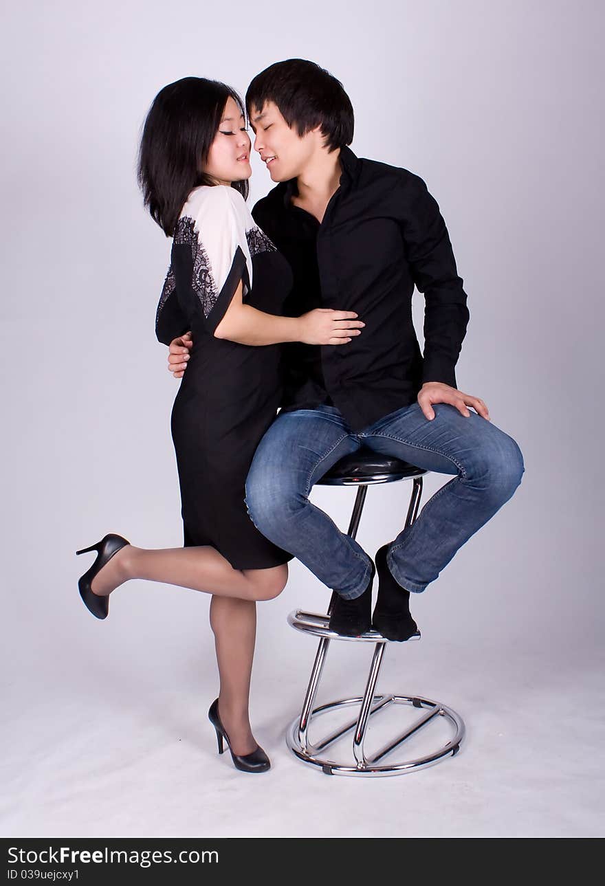 Beautiful asian loving couple in a studio.