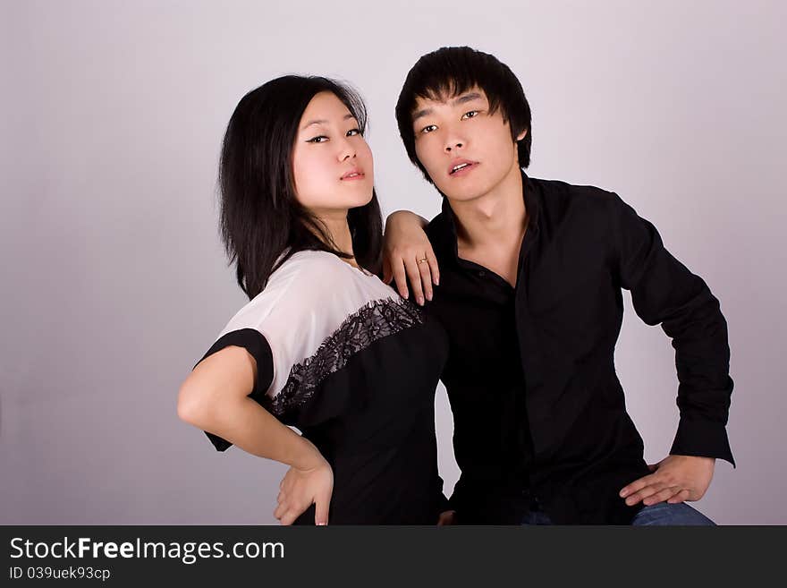 Beautiful asian loving couple in a studio.