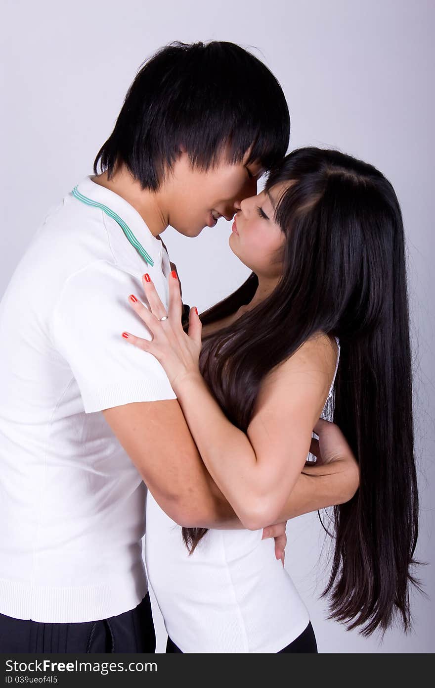 Beautiful asian loving couple in a studio.