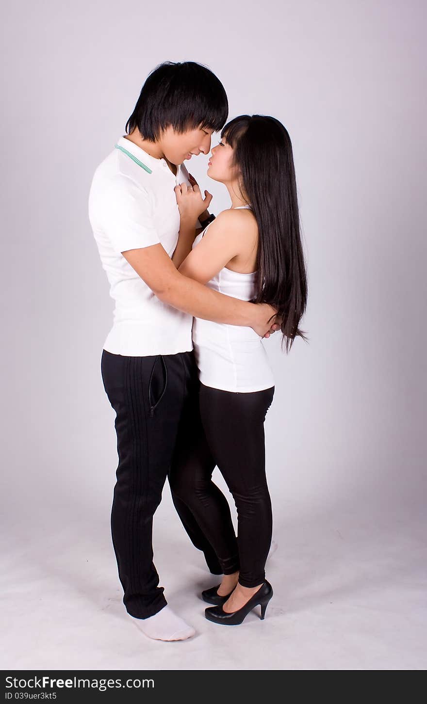 Beautiful asian loving couple in a studio.