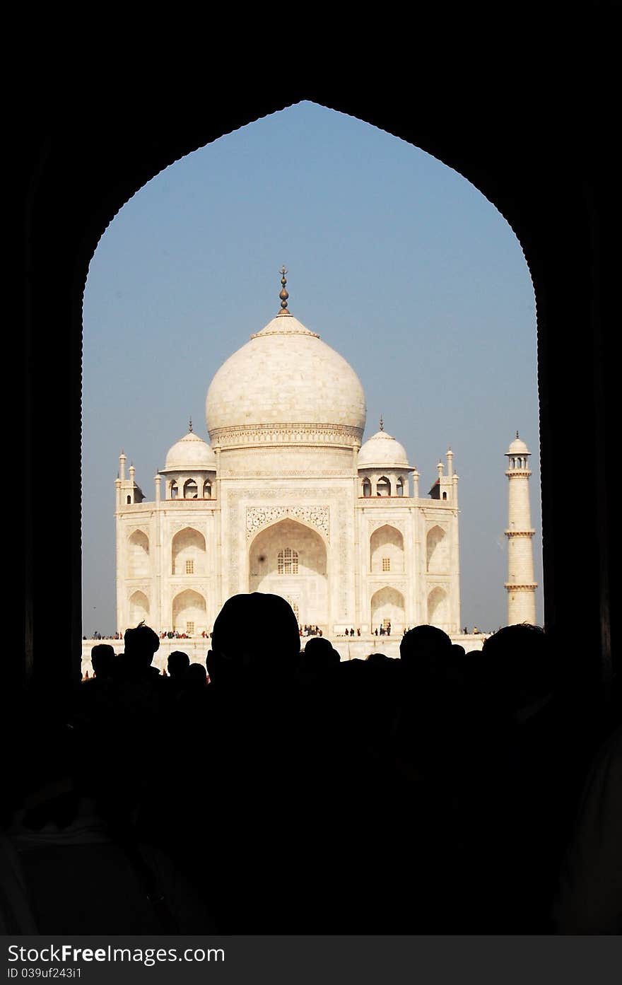 The Taj Mahal seen through an entrance gate. The Taj Mahal seen through an entrance gate