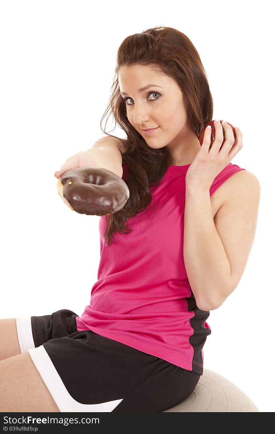 Woman fitness hand donut keep apple