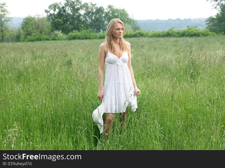 Beautiful woman on a green meadow. Beautiful woman on a green meadow