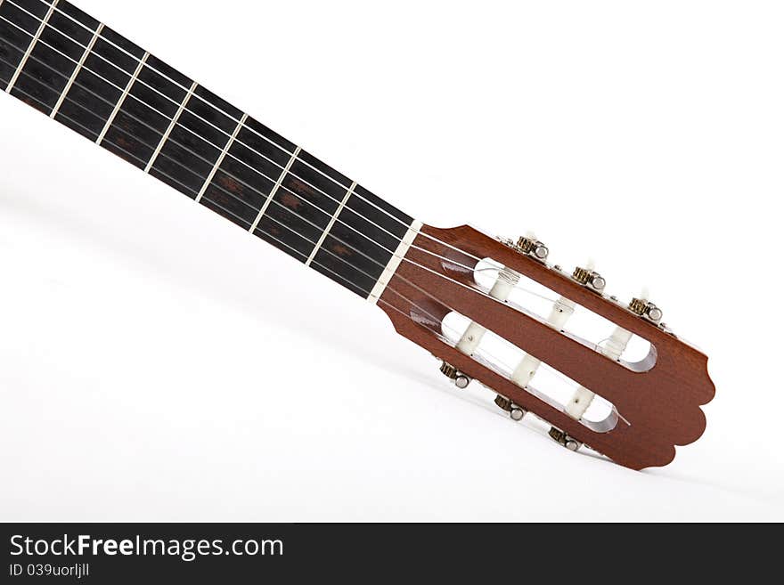 Guitar with the strings on a white background