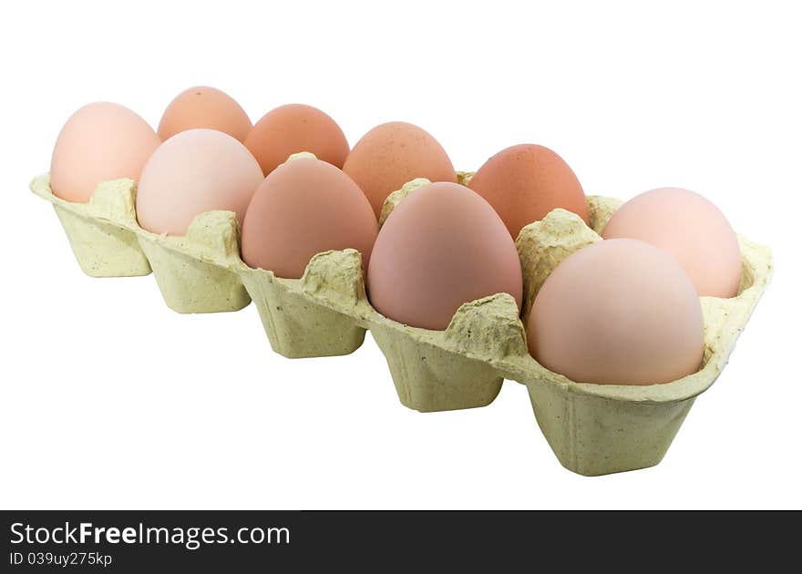 A carton of ten eggs isolated on white background. Clipping path include. A carton of ten eggs isolated on white background. Clipping path include.