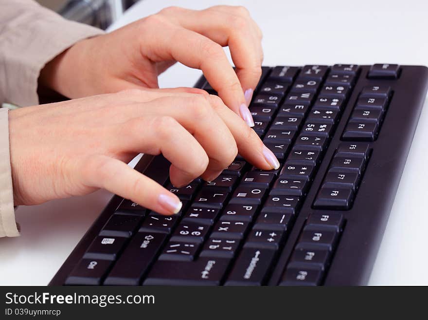 Typing on keyboard.