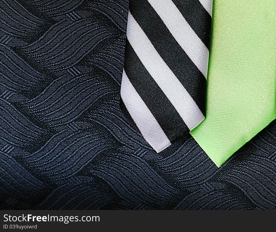 Lime Green and Striped Silk Ties on Black Textured Vest. Lime Green and Striped Silk Ties on Black Textured Vest.