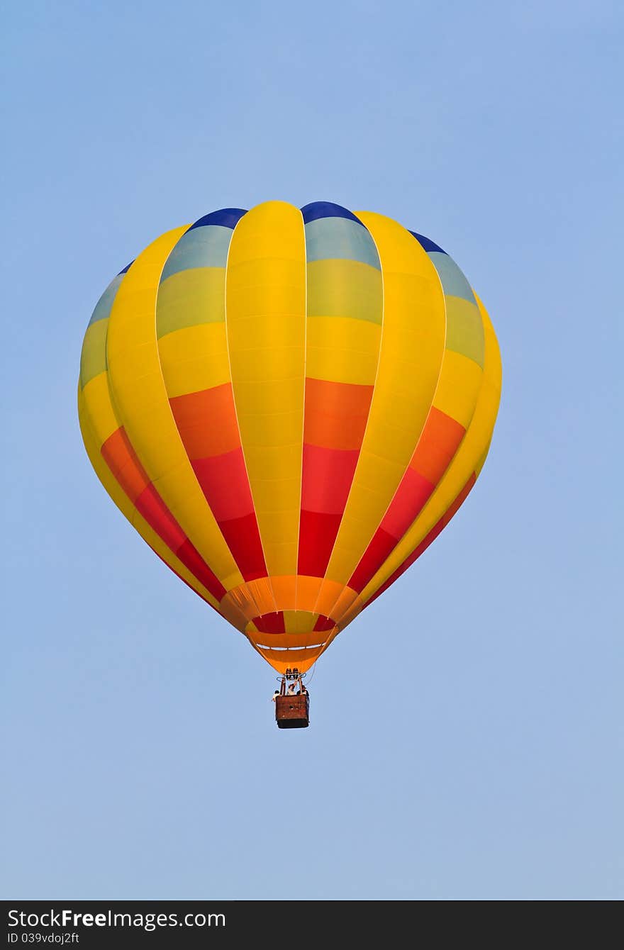 Colorful hot air balloon in blue sky