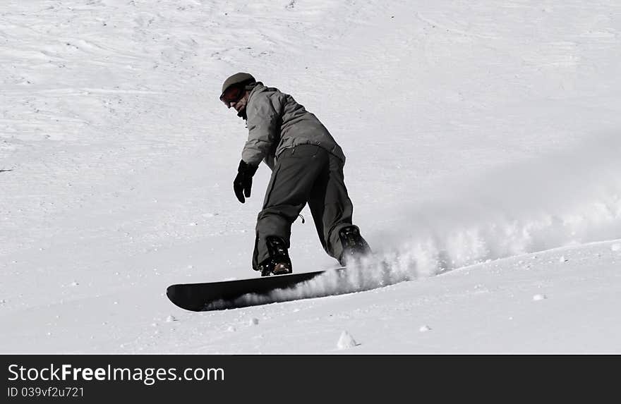 Snowboarder guy on the ski slope