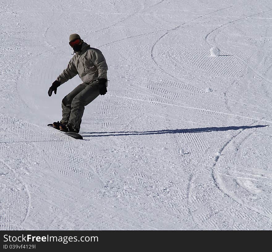 Snowboarder guy on the ski slope