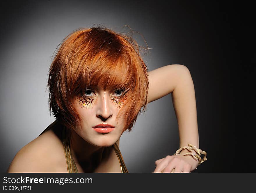 Beautiful red heaired woman portrait with creative trendy make-up and fashion hairstyle. Beautiful red heaired woman portrait with creative trendy make-up and fashion hairstyle