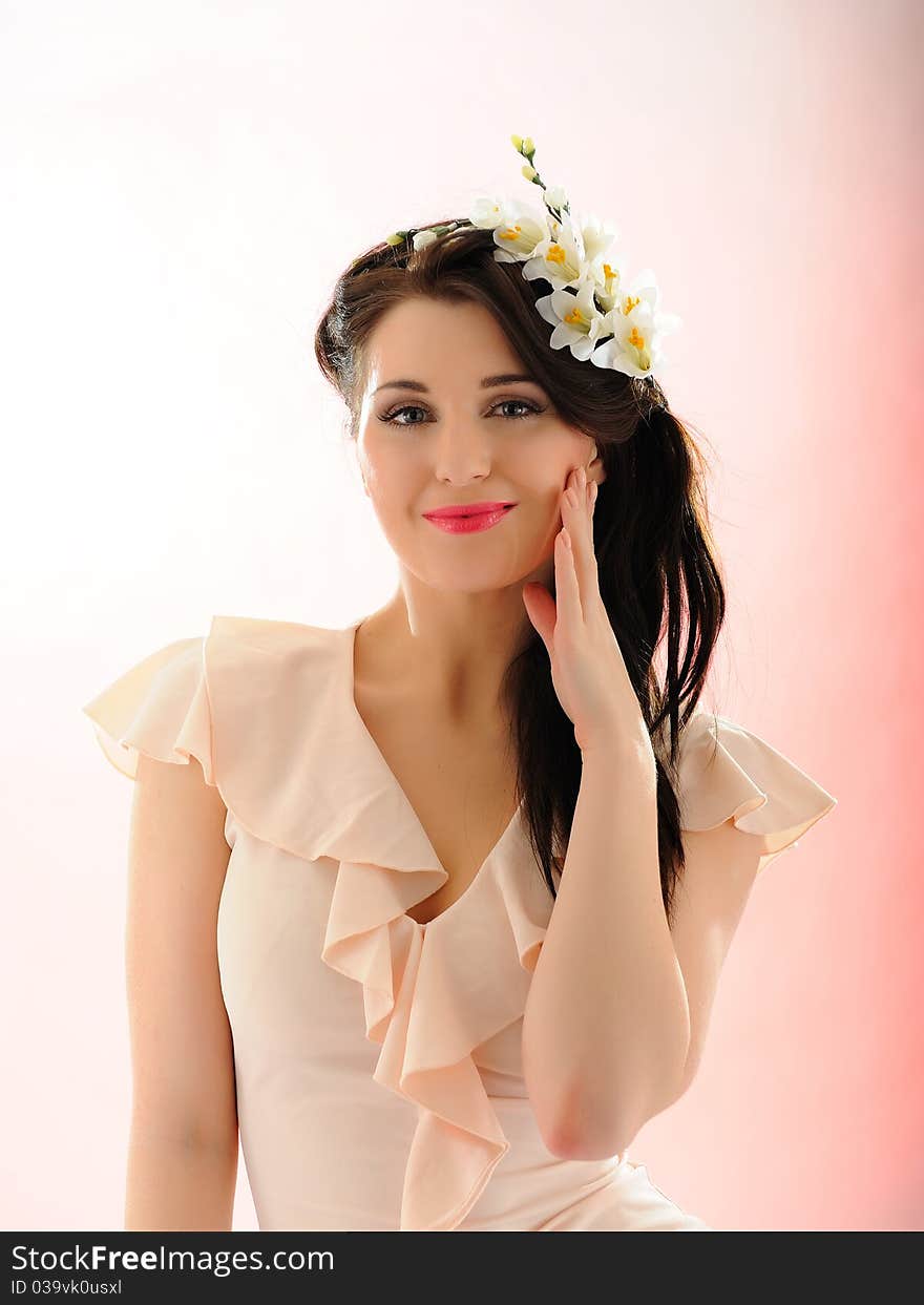 Beautiful fresh spring woman with flowers in her hair