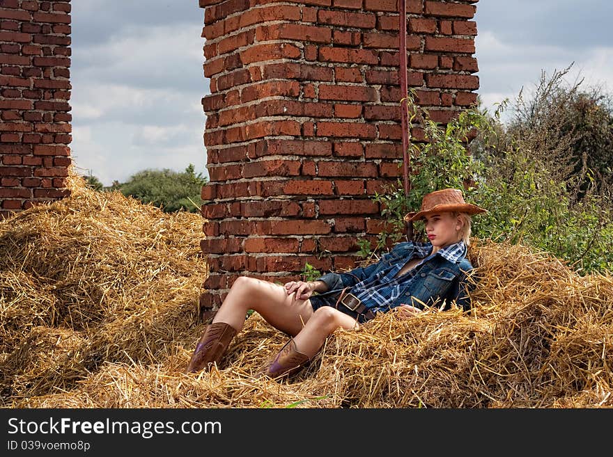 Attractive beautiful cowboy girl in village