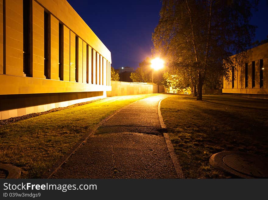 A low angle view of a tarmac path in Hobart, Tasmania, at night. A low angle view of a tarmac path in Hobart, Tasmania, at night.