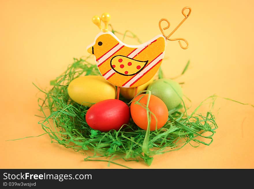 Easter chicken with colored eggs