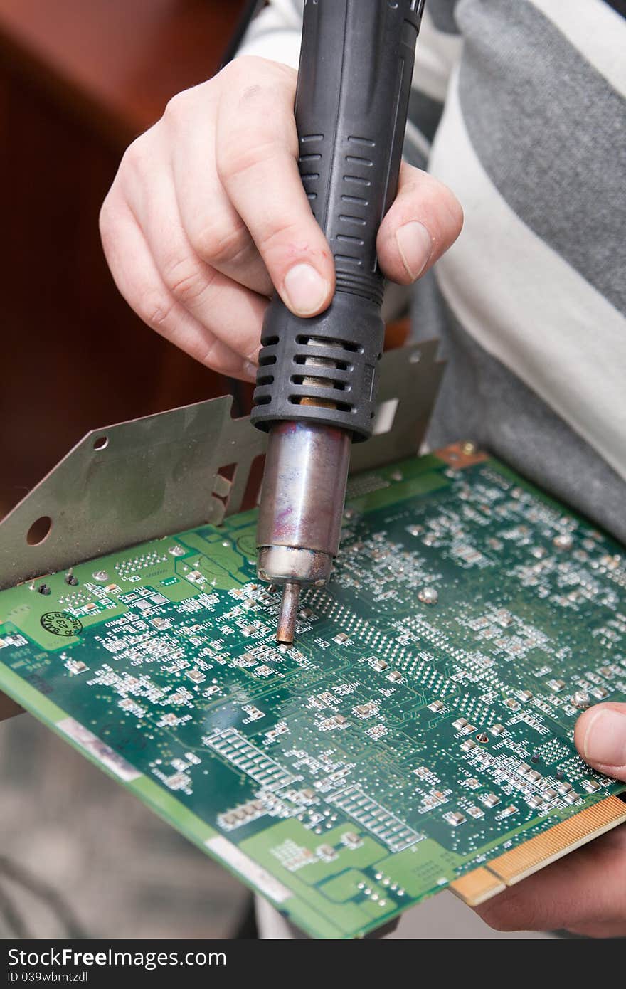 View of a circuit board being repaired