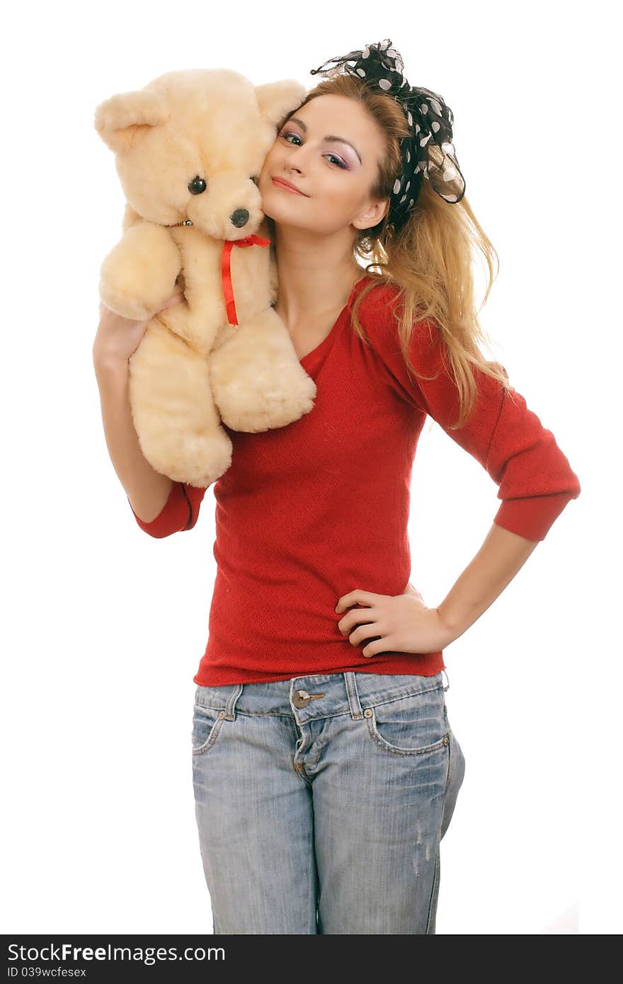 Cheerful blonde woman hugging a teddy bear. Isolated on white.