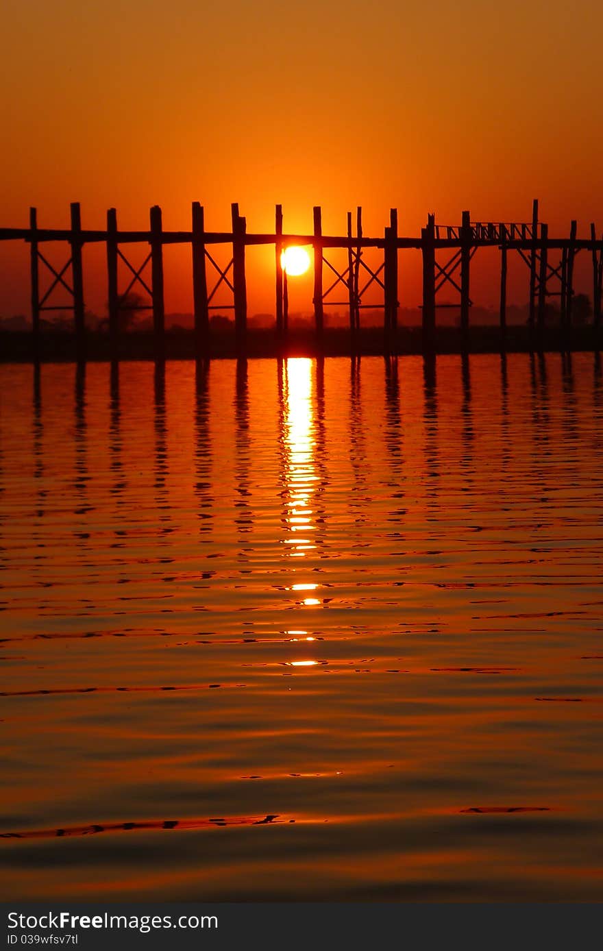 Landscape of an old wooden bridge at sunset