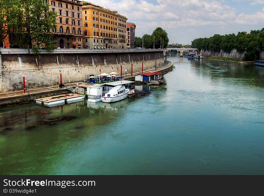 Houseboats and boats on the Tiber in Rome. Houseboats and boats on the Tiber in Rome