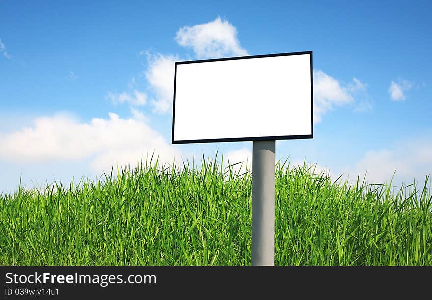 Advertising billboard on a green grass