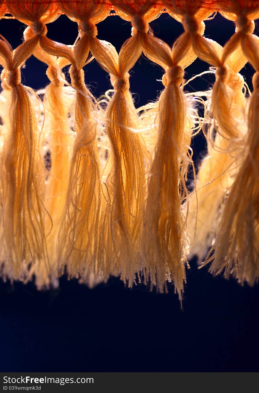 Curtain with tassel in the backlight.