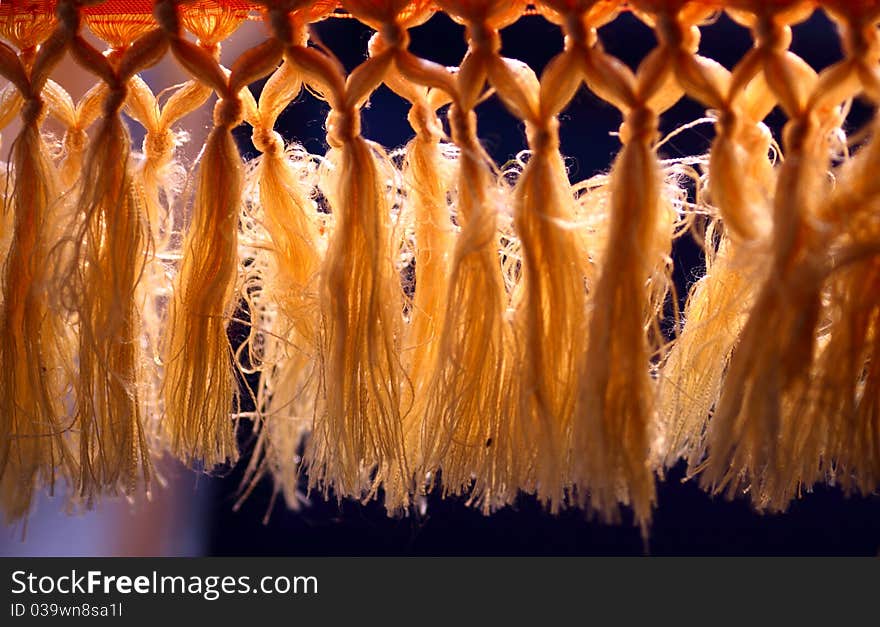 Curtain with tassel in the backlight.