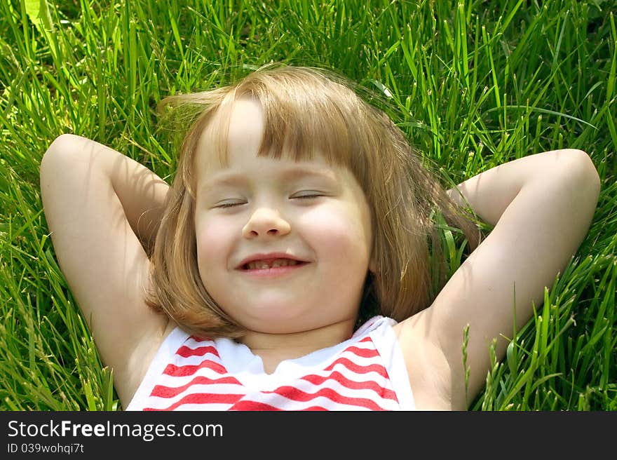 Cute Little Girl In Grass